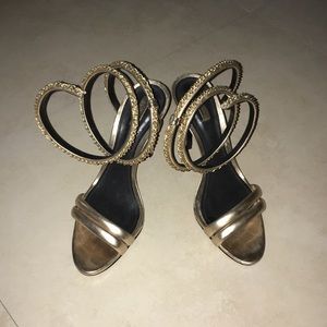 Gold Schutz ankle wrap heels